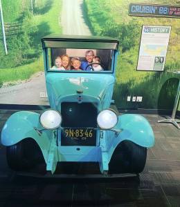 Family photo at WonderWorks Branson Route 66 Chevy