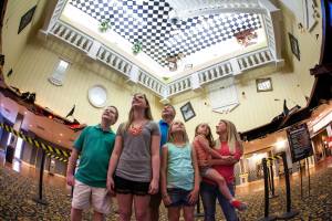 Family in the upside-down lobby of WonderWorks Pigeon Forge